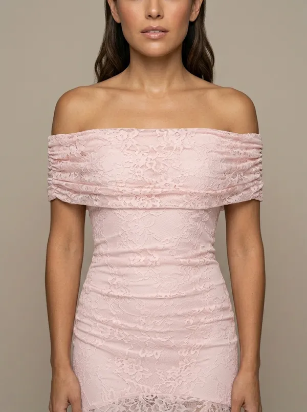 close on the ruched fold-band neckline and the lace weave of the blush gown