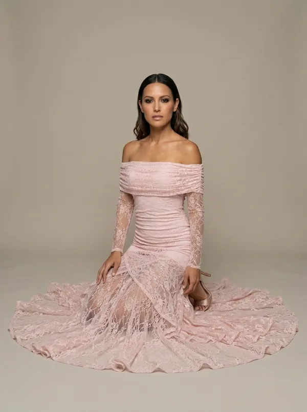 the same blush lace gown kneeling, the lace hem fanned into a full circle