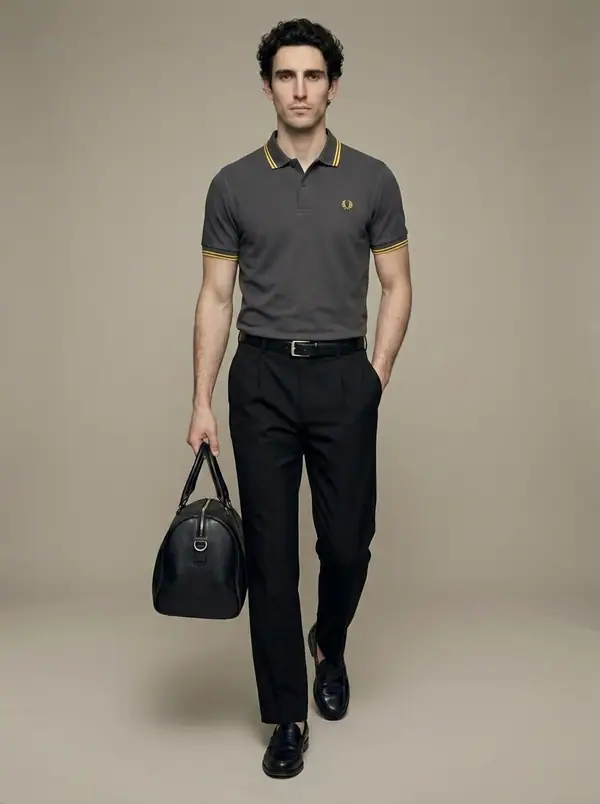 charcoal twin-tipped pique polo + holdall worn by an AI male model, studio shoot