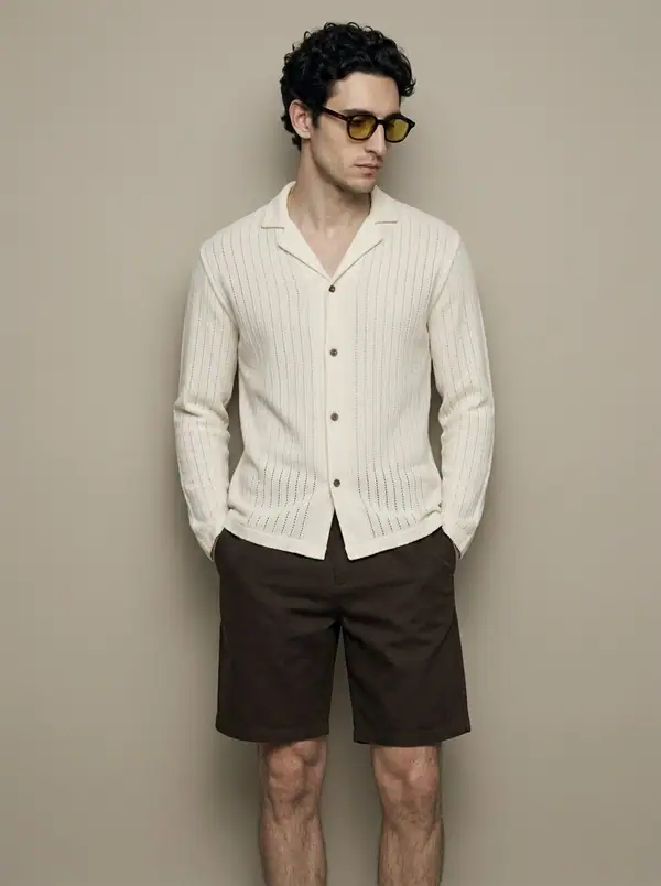 cream pointelle-stripe open-knit camp shirt worn by an AI male model, studio shoot