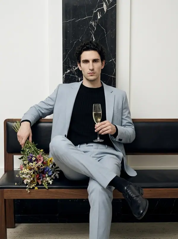 dusty powder blue suit, wine and bouquet props worn by an AI male model, editorial shoot
