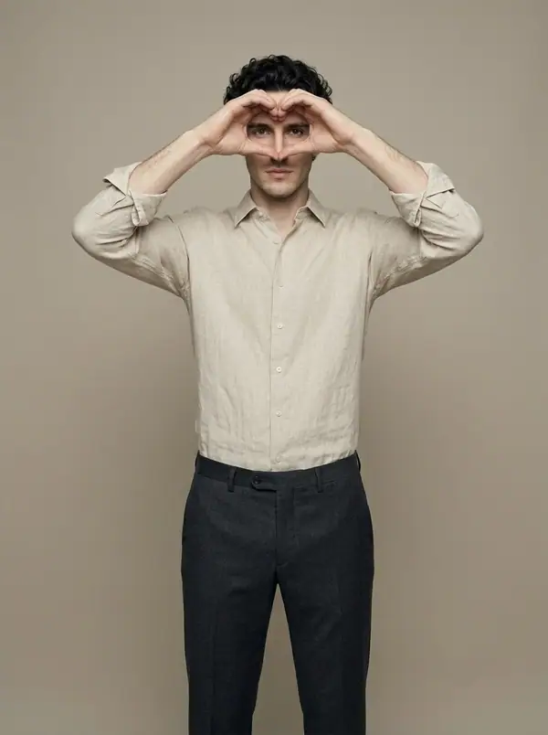 flax linen shirt, heart hands worn by an AI male model, studio shoot