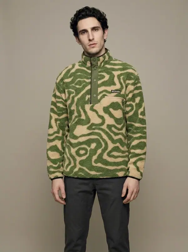 green-sand marbled-swirl sherpa popover worn by an AI male model, studio shoot