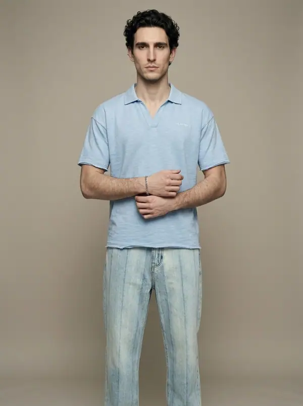 powder blue slub-knit johnny-collar polo worn by an AI male model, studio shoot