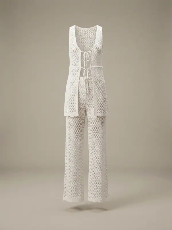 white crochet halter vest + wide crochet pants, photographed as a product shot on a studio sweep